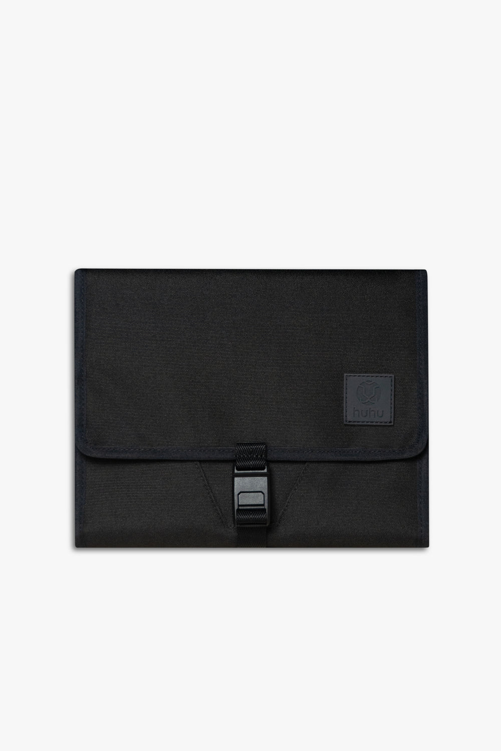 Front view of closed black changing wallet against a white background.