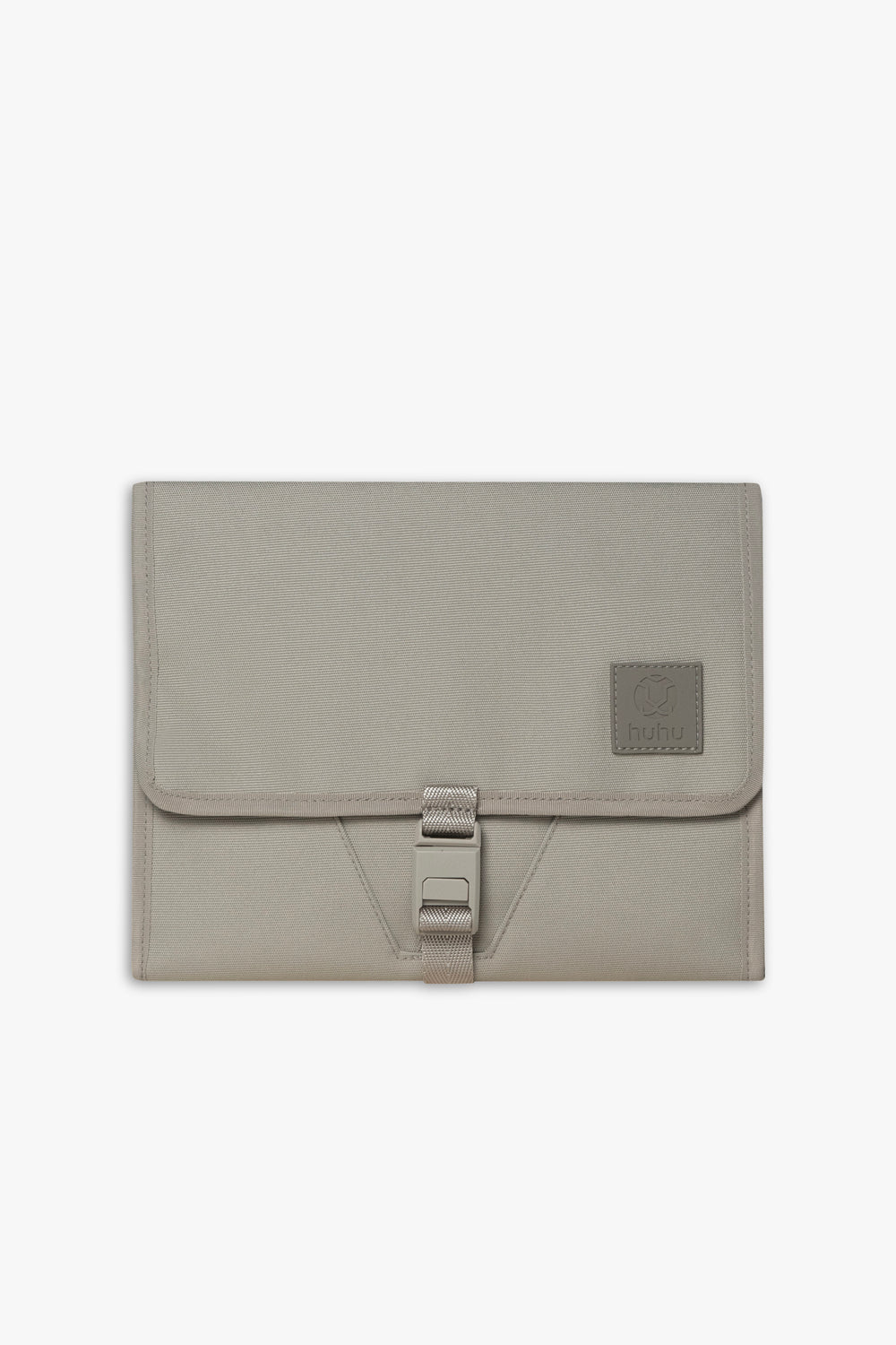 Front view of closed taupe changing wallet against a white background.